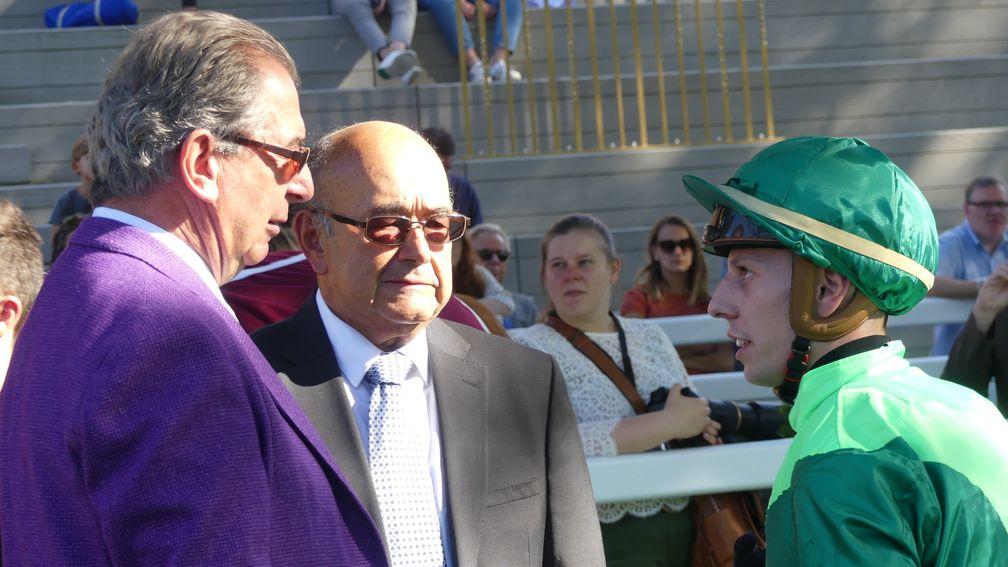 Cristian Demuro debriefs trainer Jean-Claude Rouget (left) after Sottsass overcomes a troubled passage to win the Prix Niel
