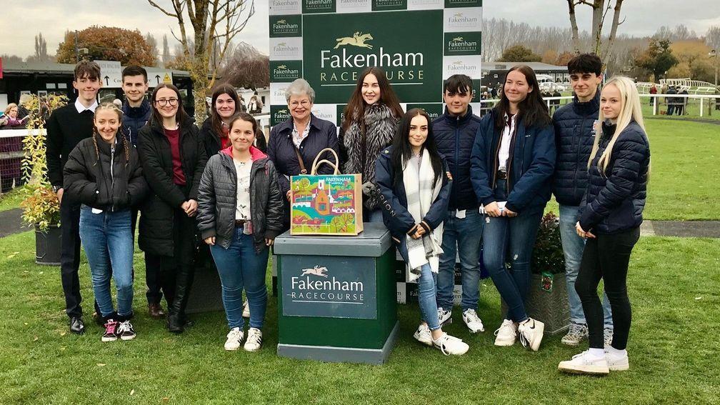 The British Racing School Course 356 students present Pat Toye with her prize after the win of Sorbet