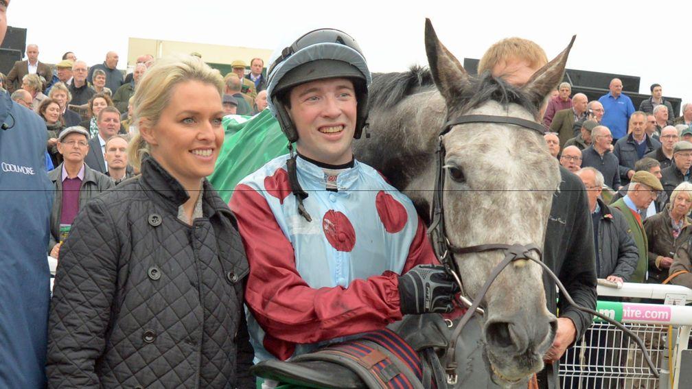 Jonathan Moore with trainer Rebecca Curtis and Irish Cavalier after the jockey's biggest career success in the Charlie Hall Chase at Wetherby