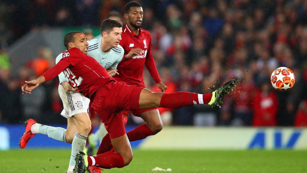 Liverpool's Joel Matip tackles Bayern Munich's Robert Lewandowski