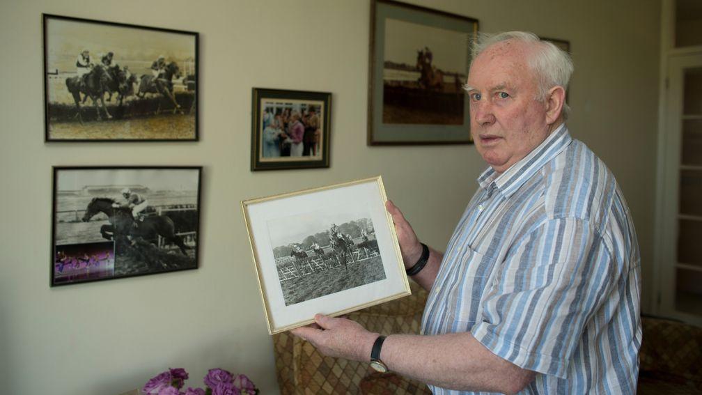 Paddy Broderick at home in Newmarket in 2013 holding a picture of Night Nurse winning the Leopardstown Hurdle