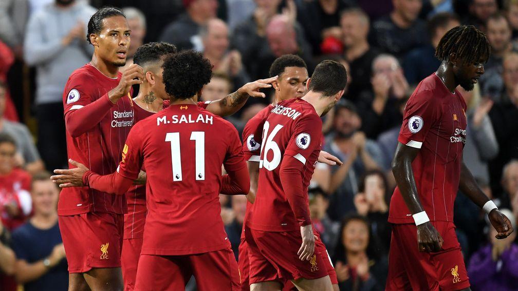 Liverpool celebrate Virgil van Dijk's goal in their 4-1 win over Norwich on Friday