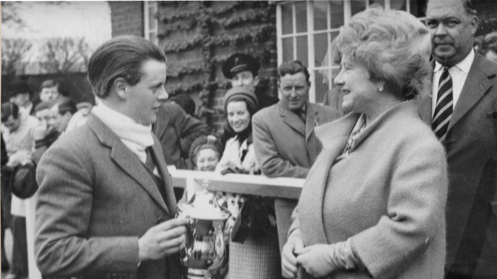 Ben Leigh receives the trophy from the Queen Mother after winning the Grand Military Gold Cup on Rueil in 1965