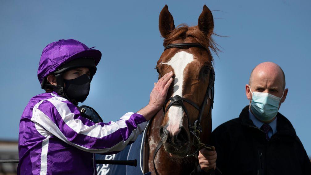 Wordsworth gets a pat off Ryan Moore after making a winning reappearance at the Curragh