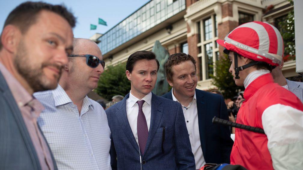 Capel Street Gang... Donnocha O'Brien debriefs brother Joseph and the owners of Red Tea after theire sterling third-placed effort in the Darley Prix Jean Romanet