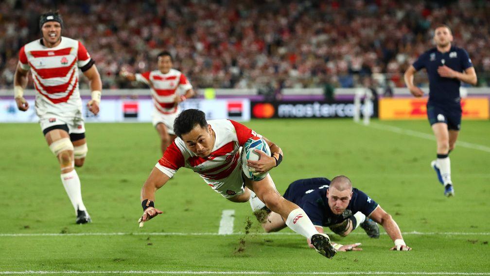 Kenki Fukuoka of Japan dives to score their third against Scotland at the Rugby World Cup