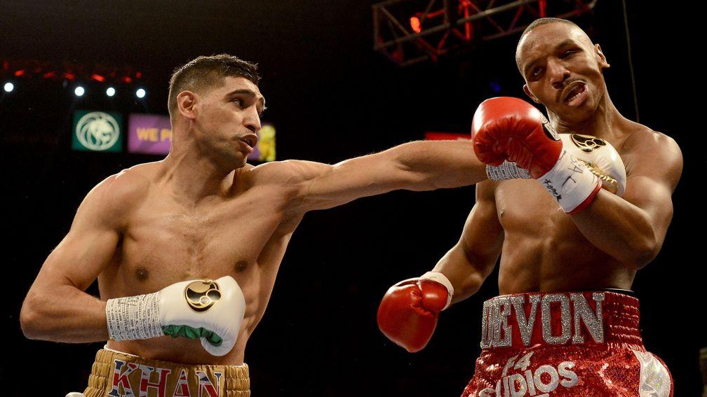 Amir Khan hits Devon Alexander during their welterweight bout at the MGM Grand Garden Arena