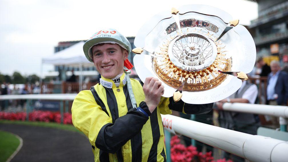 DONCASTER, ENGLAND - SEPTEMBER 11: David Egan celebrates with the trophy after riding Eldar Eldarov to win the Cazoo St Leger Stakes at Doncaster Racecourse on September 11, 2022 in Doncaster, England. (Photo by Eddie Keogh/Getty Images)
