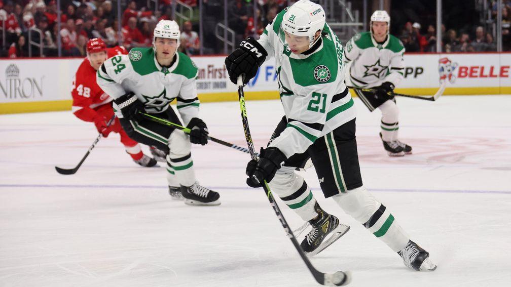 Jason Robertson of the Dallas Stars takes a shot against Detroit Red Wings