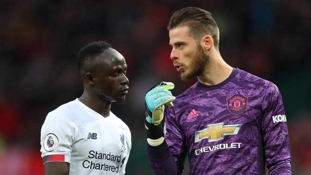 Sadio Mane of Liverpool chats to David De Gea of Manchester United