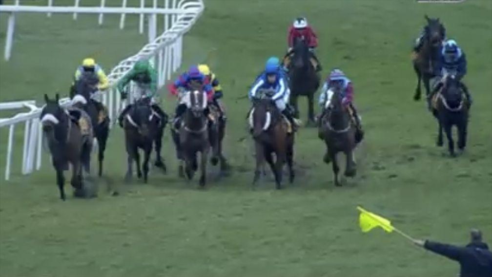 The yellow flag used to denote a void race is waved to the riders in Sandown's London National on Saturday