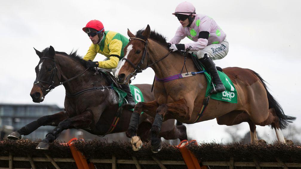 The duel is on: Faugheen (right) and Supasundae ght it out from the front in the Irish Champion Hurdle