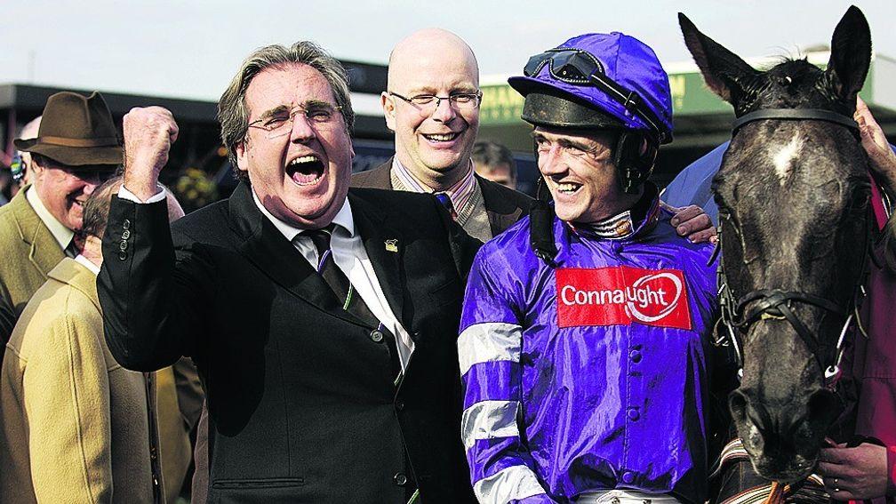 Ruby Walsh looks bemused by the owner's antics while Royal & SunAlliance Chase winner Denman takes it in his stride