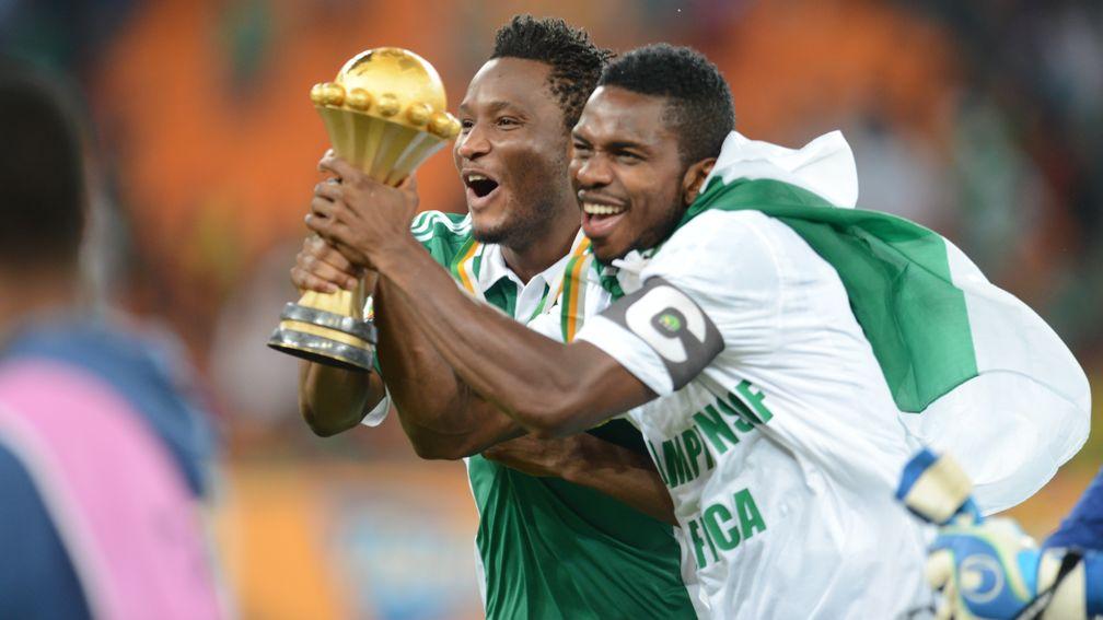 Nigeria's John Obi Mikel celebrates with the trophy in 2013