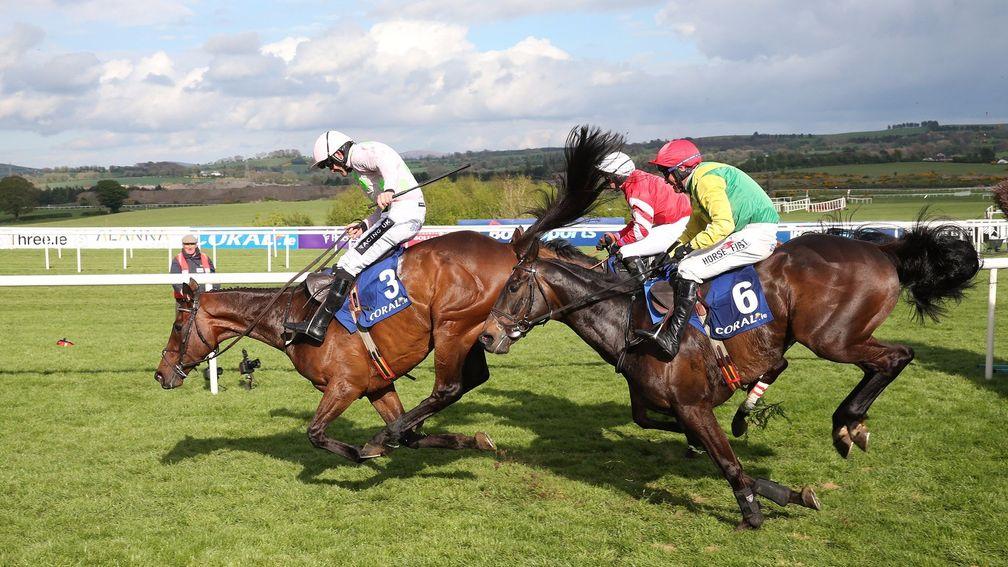 Djakadam makes a mistake in front as he is pursued at the last by Sizing John (red cap), who got up by a short head, and Coneygree