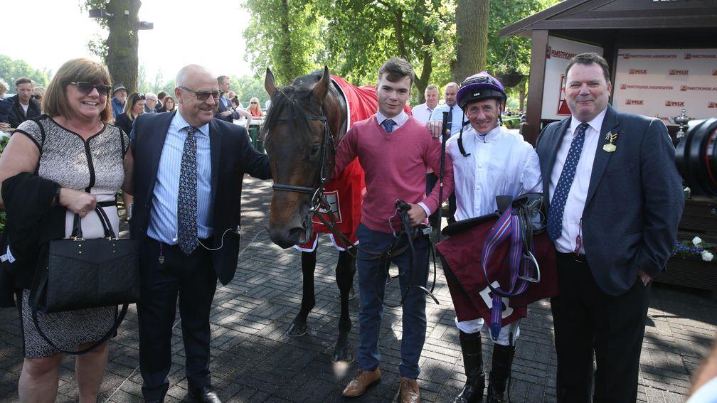 Peter Swann (right) with connections after Sands Of Mali's win in the Sandy Lane Stakes