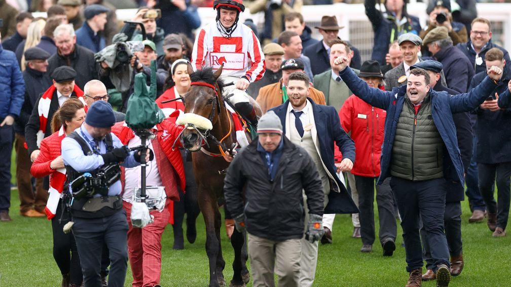 The Real Whacker's connections celebrate as he returns to the Cheltenham winner's enclosure