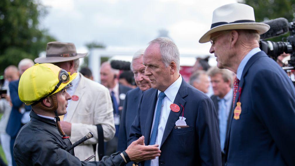Andrea Atzeni speaks to Bjorn Nielsen and John Gosden after  the Goodwood CupGoodwood 26.7.22 Pic: Edward Whitaker
