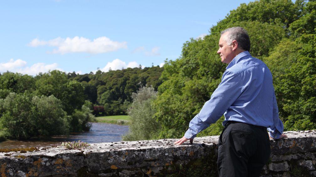 John O'Connor, the Ballylinch managing director, on the bridge over the River Nore that divides the stud from its former parent estate at Mount Juliet