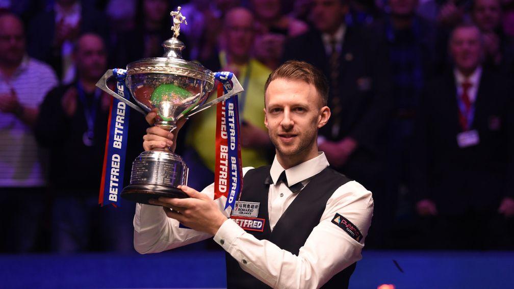 Judd Trump lifts the Crucible trophy after his superb final victory over John Higgins