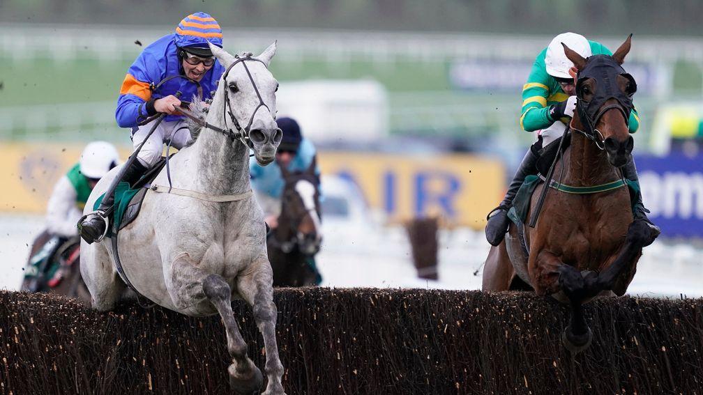 Any Second Now (right) hits the front on his way to winning the Kim Muir at Cheltenham