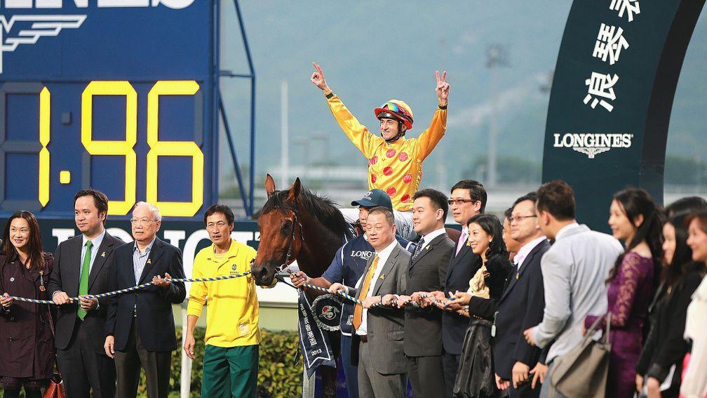 Doug Whyte, aboard Akeed Mofeed, celebrates victory in the Hong Kong Cup in 2013