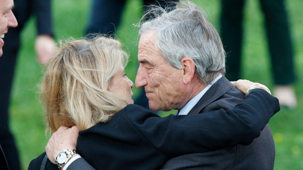 Luca Cumani gives his wife Sara a kiss following their success with God Given