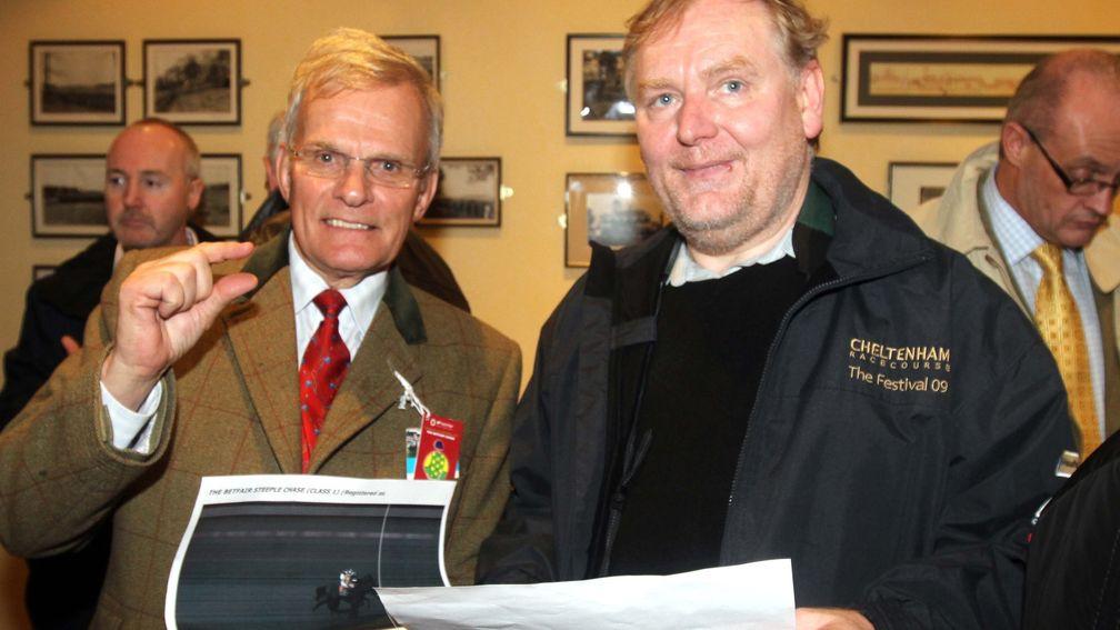 It was that close: Kauto Star's owner Clive Smith (left) and Imperial Commander's owner Ian Robinson of the Our Friends In The North syndicate examine the photo-finish print after the 2009 Betfair Chase