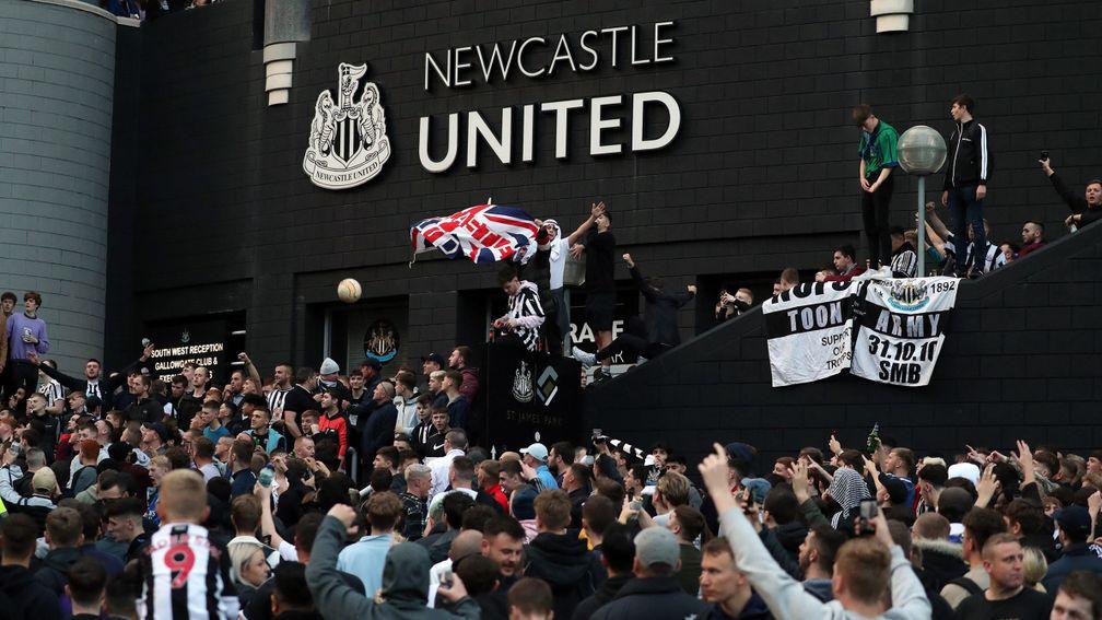 Newcastle fans celebrate news of their takeover
