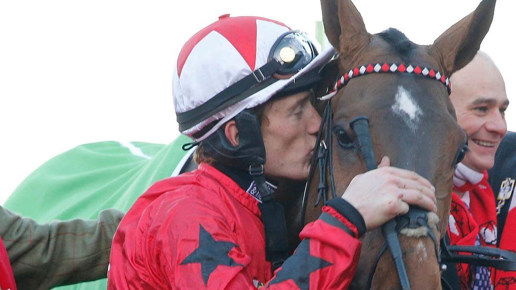 Sam Twiston-Davies gives The New One a kiss after winning at Cheltenham