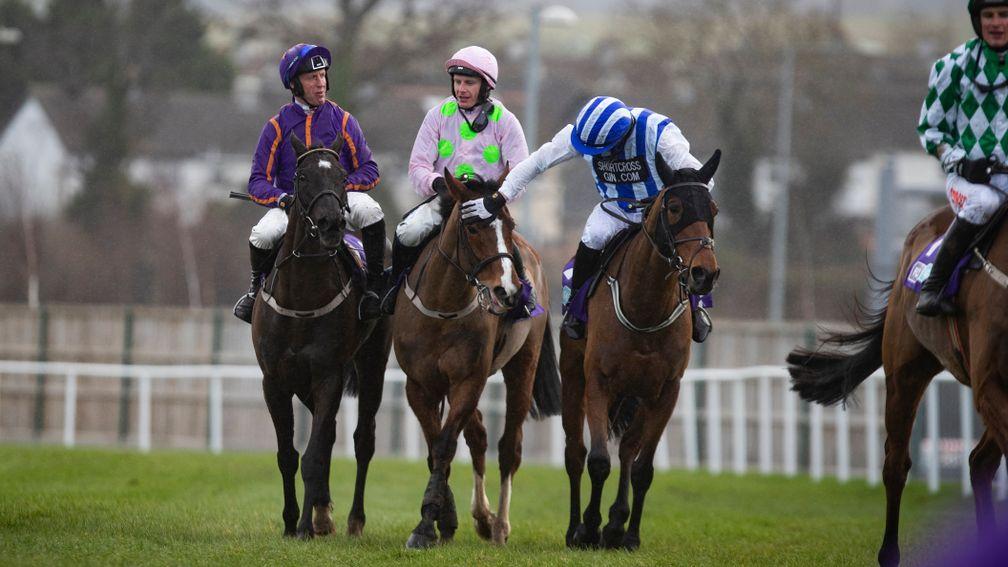 Paul Townend is congratulated by Mikey Fogarty (right) and Robbie Power (left) after winning the Flogas Novice Chase on Faugheen at Leopardstown