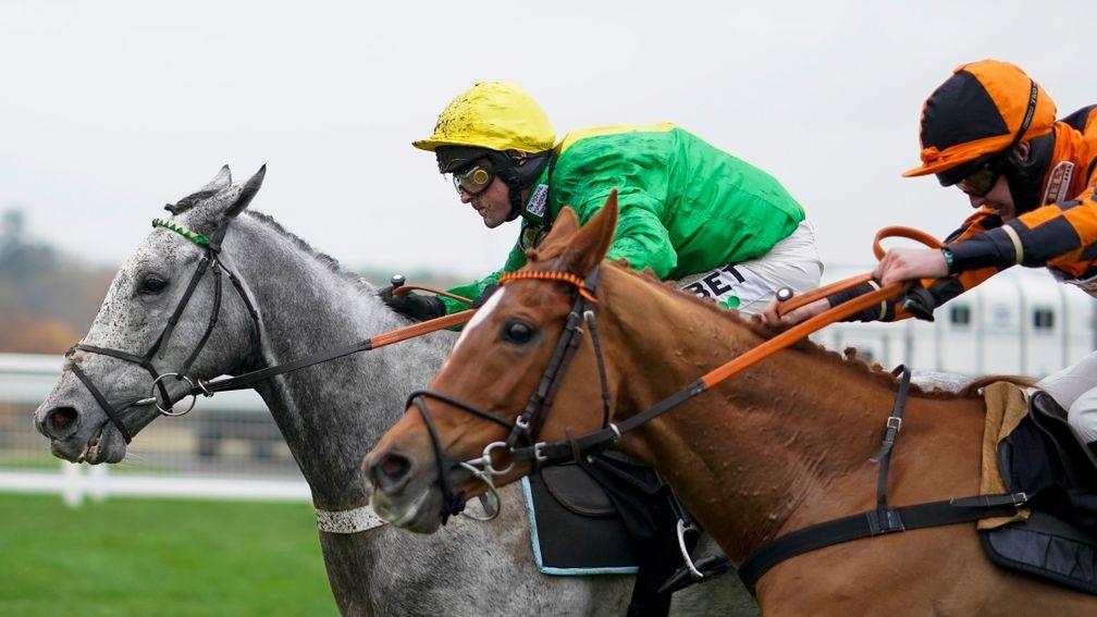 ASCOT, ENGLAND - NOVEMBER 20: Nico de Boinville riding Buzz (green) clear the last to win The Coral 'Fail To Finish' Free Bet Handicap Hurdle at Ascot Racecourse on November 20, 2020 in Ascot, England. Owners are allowed to attend if they have a runner at