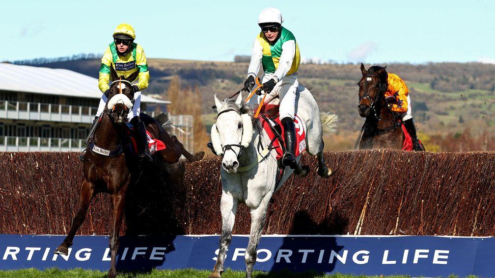 Vintage Clouds (right) fends off Happygolucky jumping the last to finally claim Cheltenham Festival glory