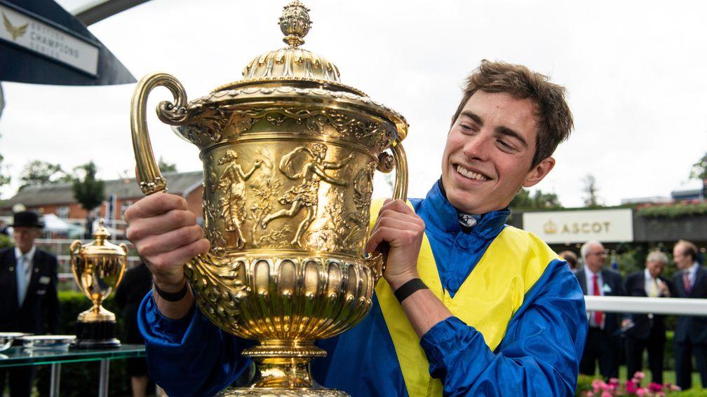 Winning jockey James Doyle with the King George VI and Queen Elizabeth Stakes trophy after victory on Poet's Word in 2018