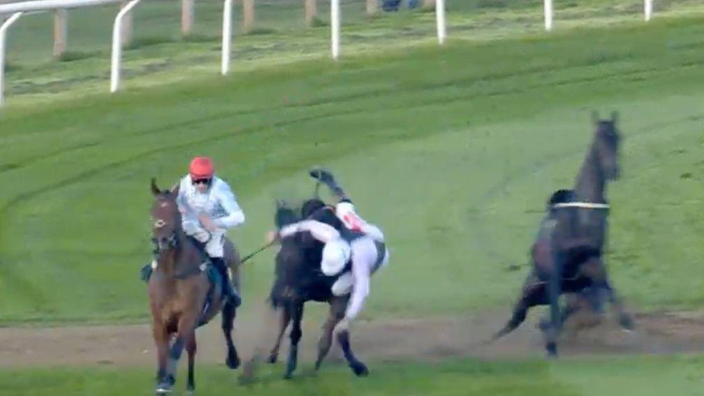 Jamie Moore, the rider of Larry, is dislodged from the saddle after the dramatic incident