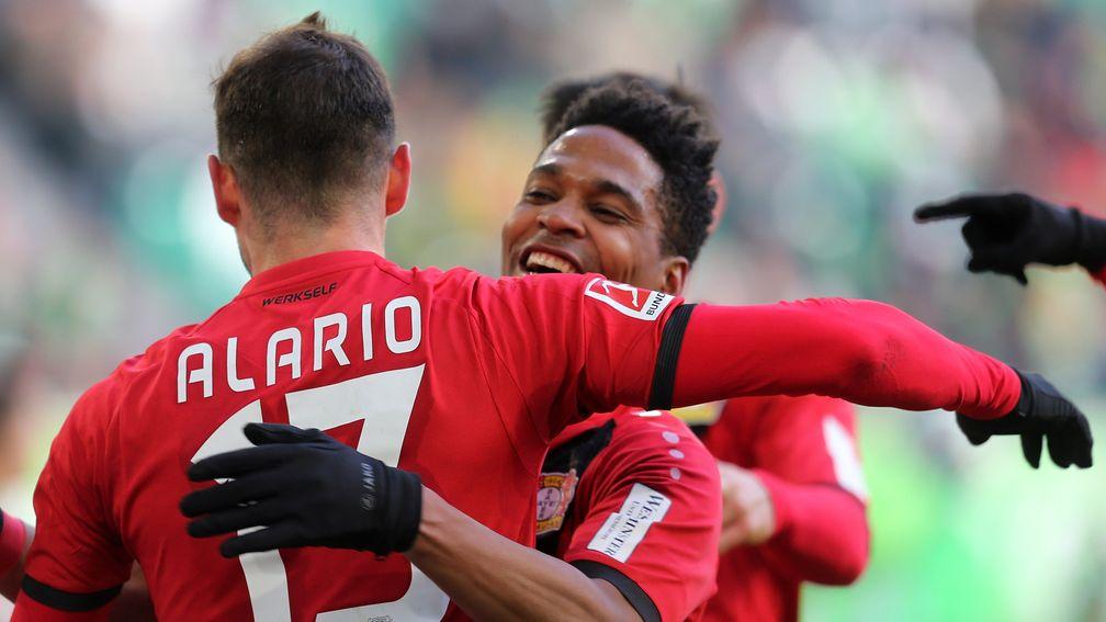 Lucas Alario and Wendell celebrate a Bayer Leverkusen goal against Wolfsburg