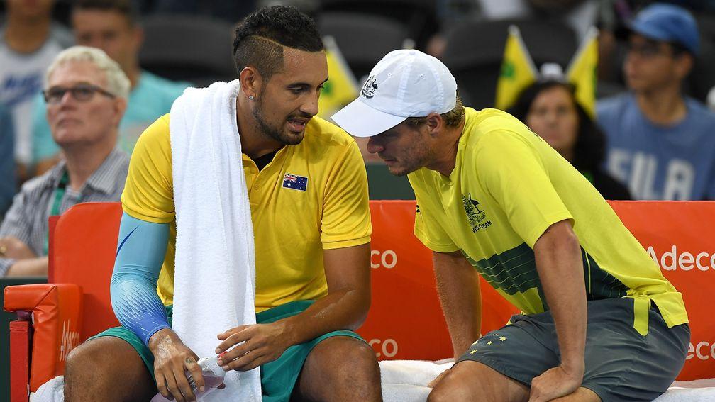 Nick Kyrgios (left) has a word with Aussie Davis Cup captain Lleyton Hewitt