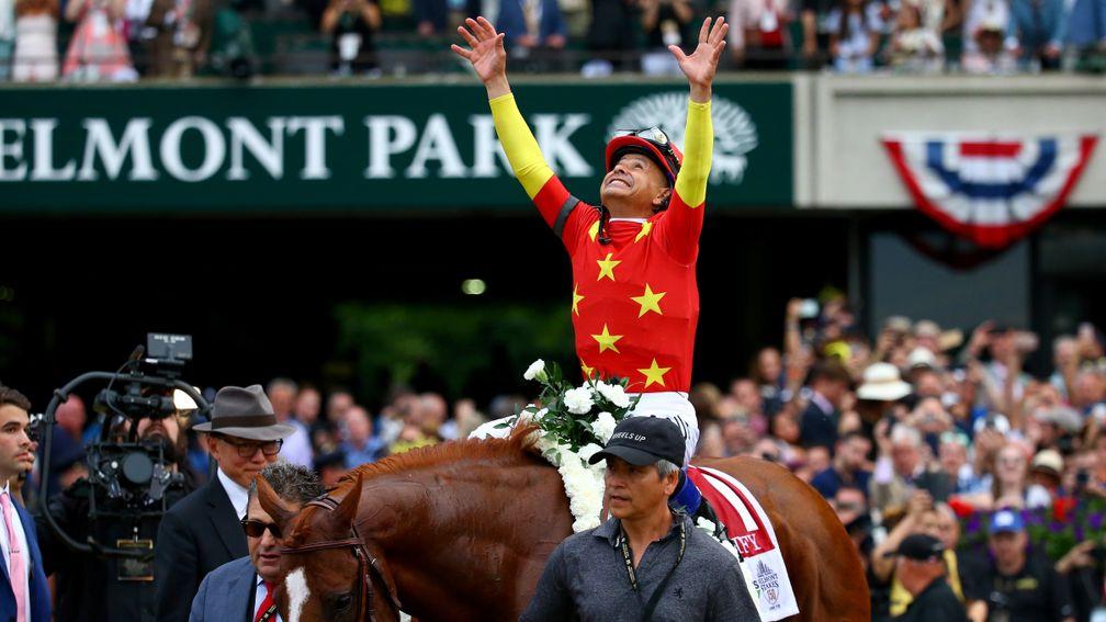 Mike Smith celebrates Justify's Triple Crown after landing the Belmont Stakes, an event that was a huge focus of sporting attention in the US