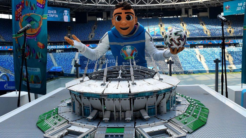 Euro 2020 mascot Skillzy poses with a Lego model of the Krestovsky Stadium in St Petersburg