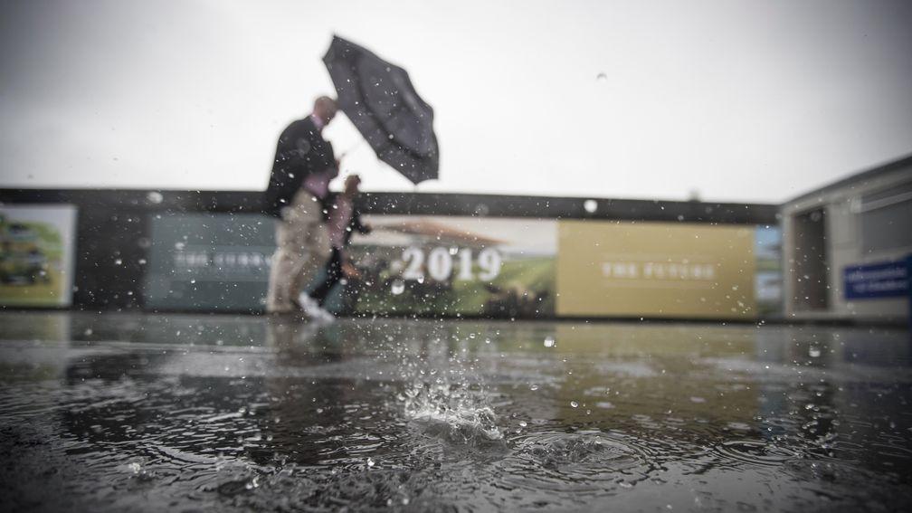 Racegoers fighting weather conditions.The Curragh.Photo: Patrick McCann 24.05.2017