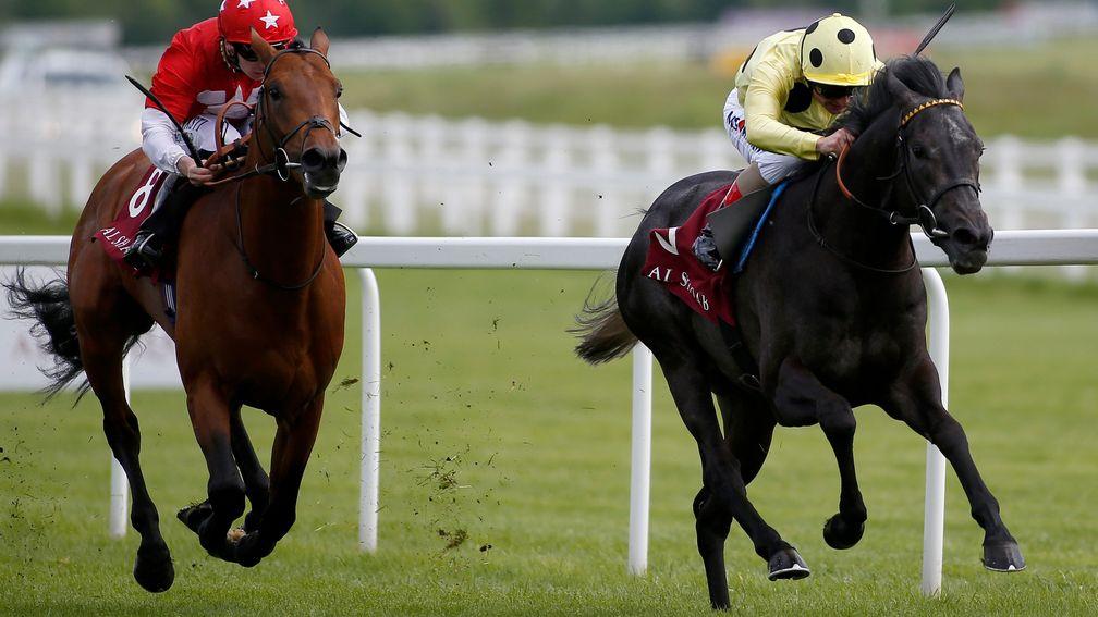 Defoe (right) keeps on strongly to win the London Gold Cup