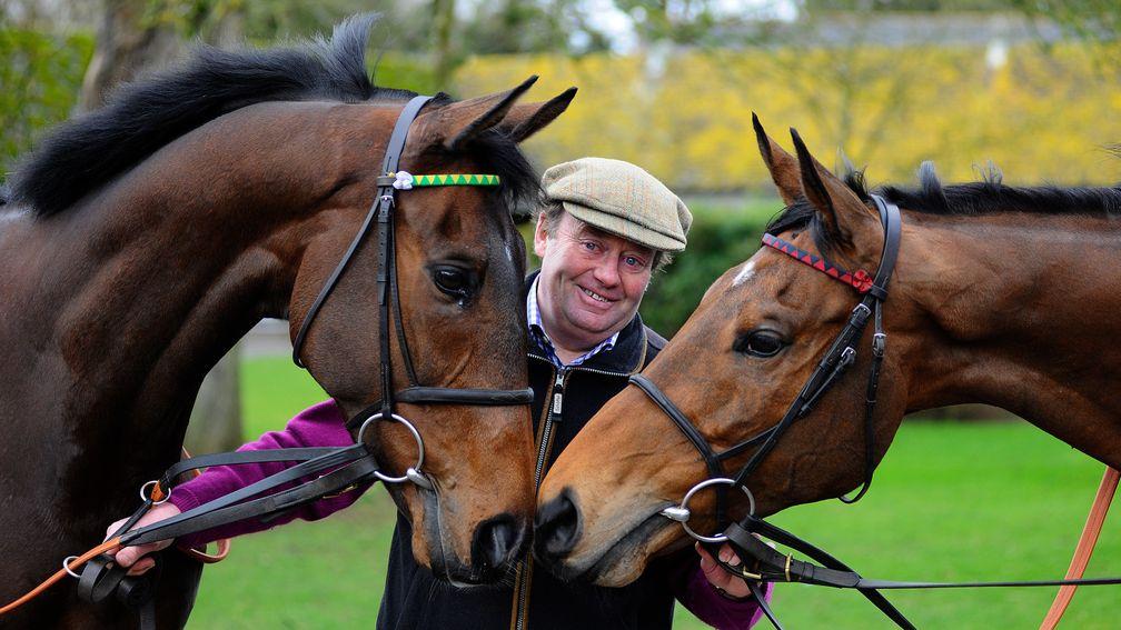 LAMBOURN, ENGLAND - FEBRUARY 25:  Nicky Henderson with My Tent Or Yours (L), entered for the Champion Hurdle and Bobs Worth (R) entered for Gold Cup at Seven Barrows Stables on February 25, 2014 in Lambourn, England. (Photo by Alan Crowhurst/Getty Images)