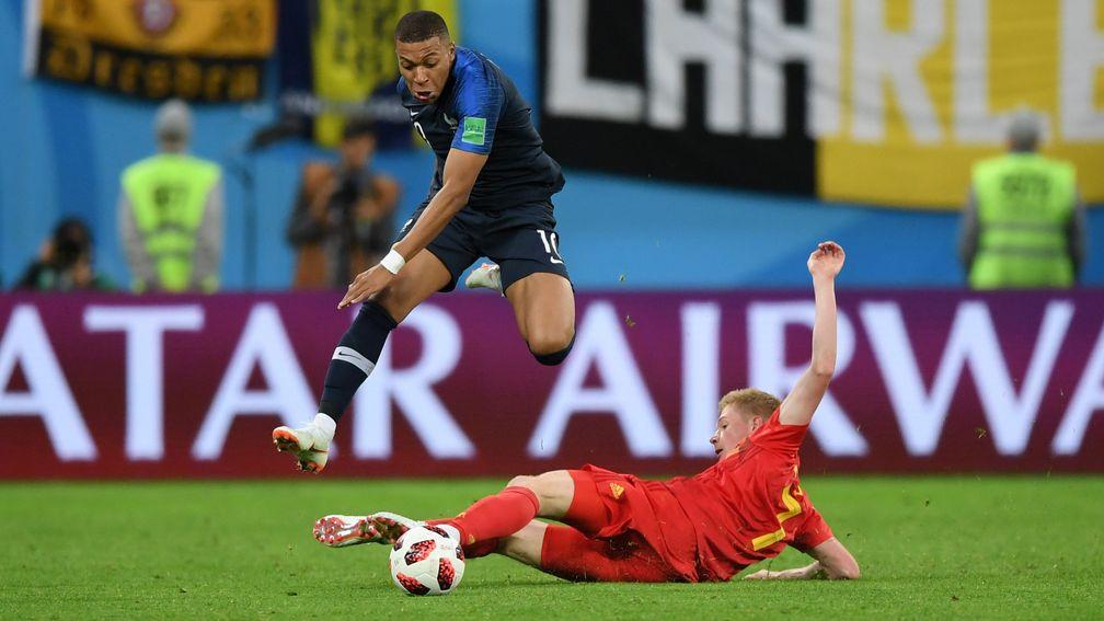 Belgium's Kevin de Bruyne challenges France star Kylian Mbappe at the 2018 World Cup