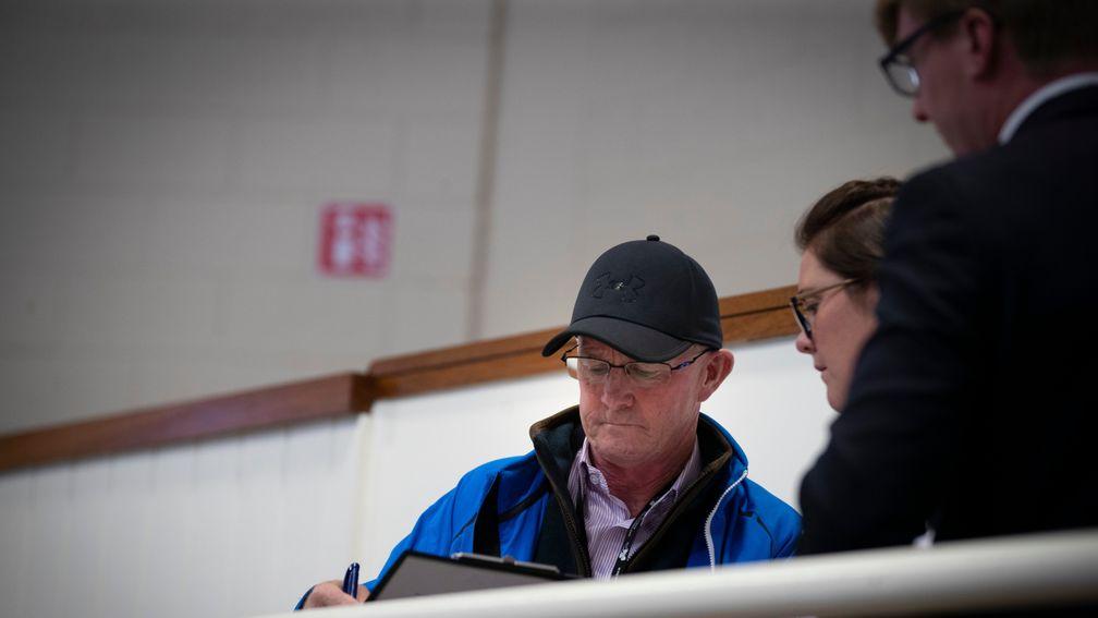 Mick Kinane, pictured signing for one of the top lots for the Hong Kong Jockey Club at this week's September Yearling Sale at Tattersalls