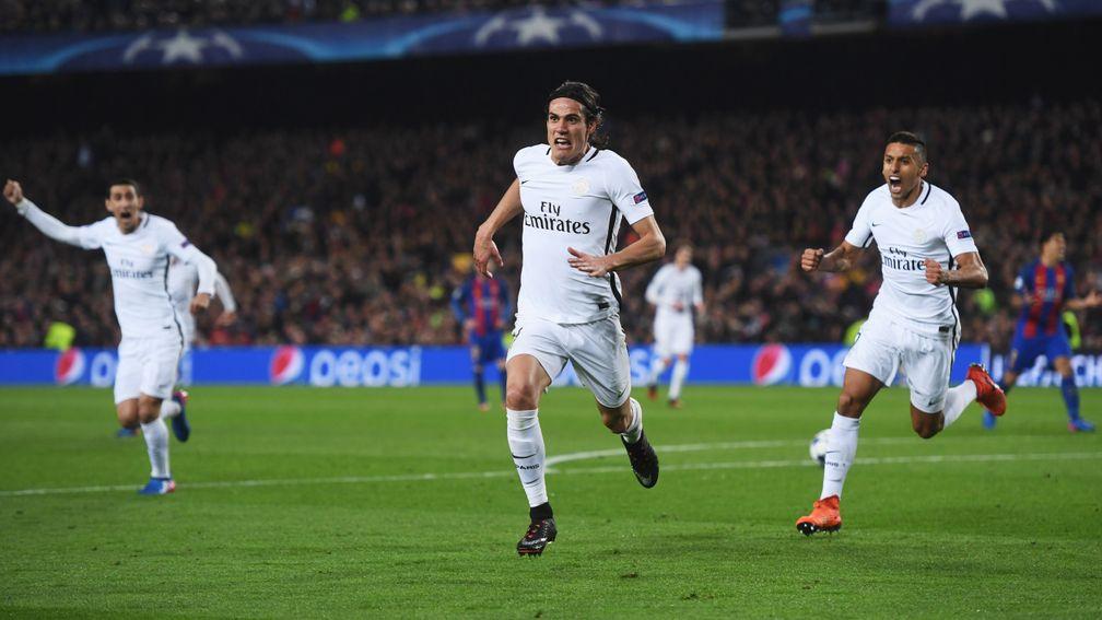 Edinson Cavani celebrates a Champions League goal with PSG teammates