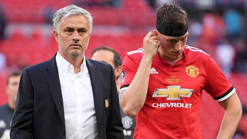 An understandable downbeat Jose Mourinho and Phil Jones at Wembley