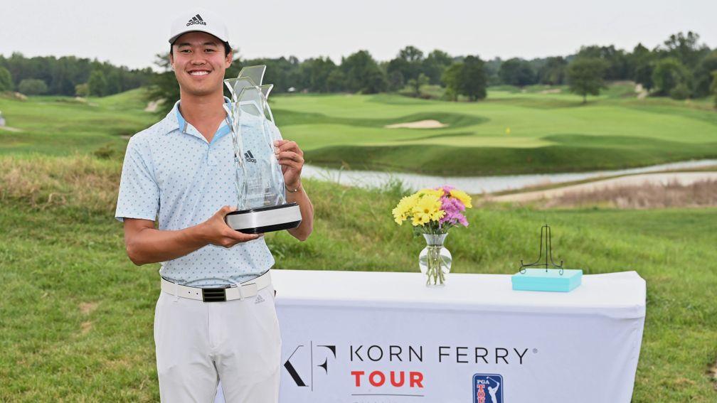 Brandon Wu poses with the trophy after winning the Korn Ferry Tour Championship at Victoria National Golf Club