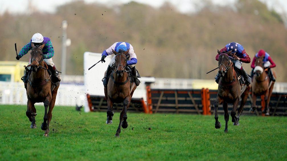 ASCOT, ENGLAND - DECEMBER 19: Aidan Coleman riding Paisley Park (R, spotted cap) clear the last to win The Porsche Long Walk Hurdle from Richard Johnson and Thyme Hill (L, white cap) at Ascot Racecourse on December 19, 2020 in Ascot, England. Owners are a