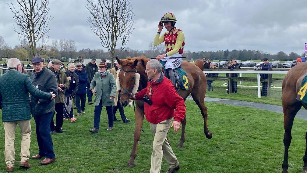 Le Tueur and Jay Tidball are led in after their win in the 3m5f chase at Fakenham 